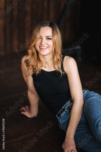 Portrait of pretty woman in studio. Young female posing to photographer