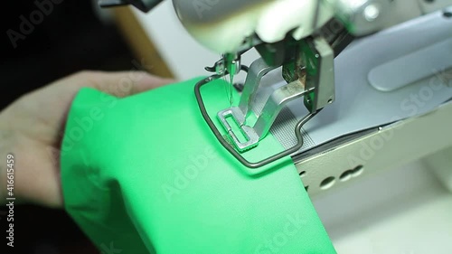Sewing production. Machine for stitching on fabric.