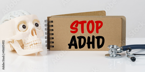 On the table lies a skull, a stethoscope and a notebook with the inscription - STOP ADHD