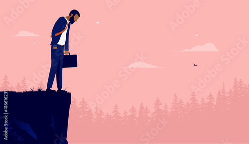 Sad ethnic businessman - Man standing on edge of cliff looking down, feeling hopeless and depressed. Career problems concept. Vector illustration.
