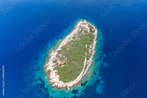 Aerial drone shot of Host Island in Adriatic sea near town port of Vis Island in Croatia summer © Davidzfr