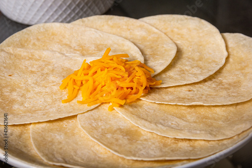 soft tacos with cheese on top  closed view