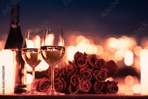 Romantic date night concept. Champagne and roses.
