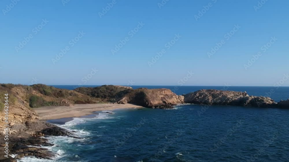 Aerial view of beach of Punta Cometa, Mazunte, Oaxaca, Mexico, wide shot approach Aerial view of beach of Punta Cometa, Mazunte, Oaxaca, Mexico, wide shot approach