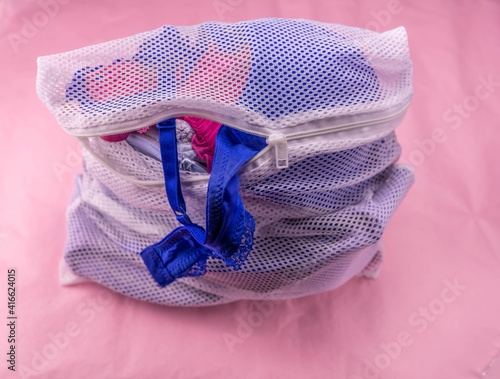 laundry net on pink background photo