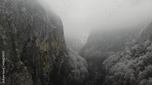 Aerial view approaching the Oltet River Canyon covered with fog photo