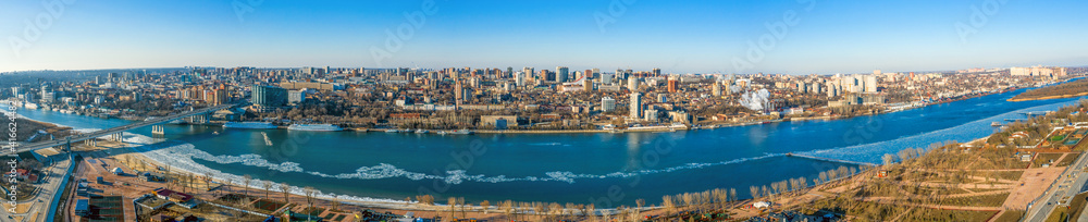 Panoramic view of Don river and right bank of Rostov-on-Don city with many buildings, Russian big city in winter time aerial view. Panoramic view of Don river and right bank of Rostov-on-Don city with many buildings, Russian big city in winter time aerial view.