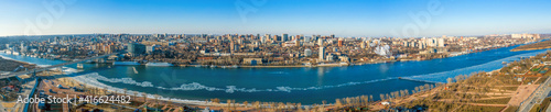 Panoramic view of Don river and right bank of Rostov-on-Don city with many buildings, Russian big city in winter time aerial view.