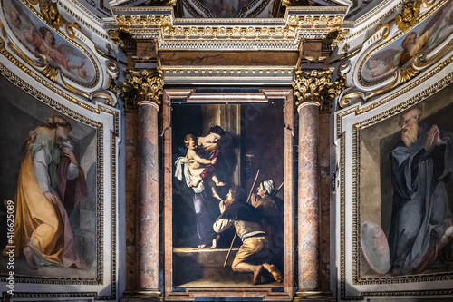 Altarbild mit der Madonna di Loreto des italienischen Barock Meisters Caravaggio in der Cavalletti Kapelle der Kirche S. Agostino in Campo Marzio in der Nähe der Piazza Navona in Rom photo