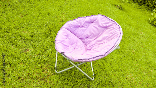 фотографія Country lilac chair in the sun on the lawn