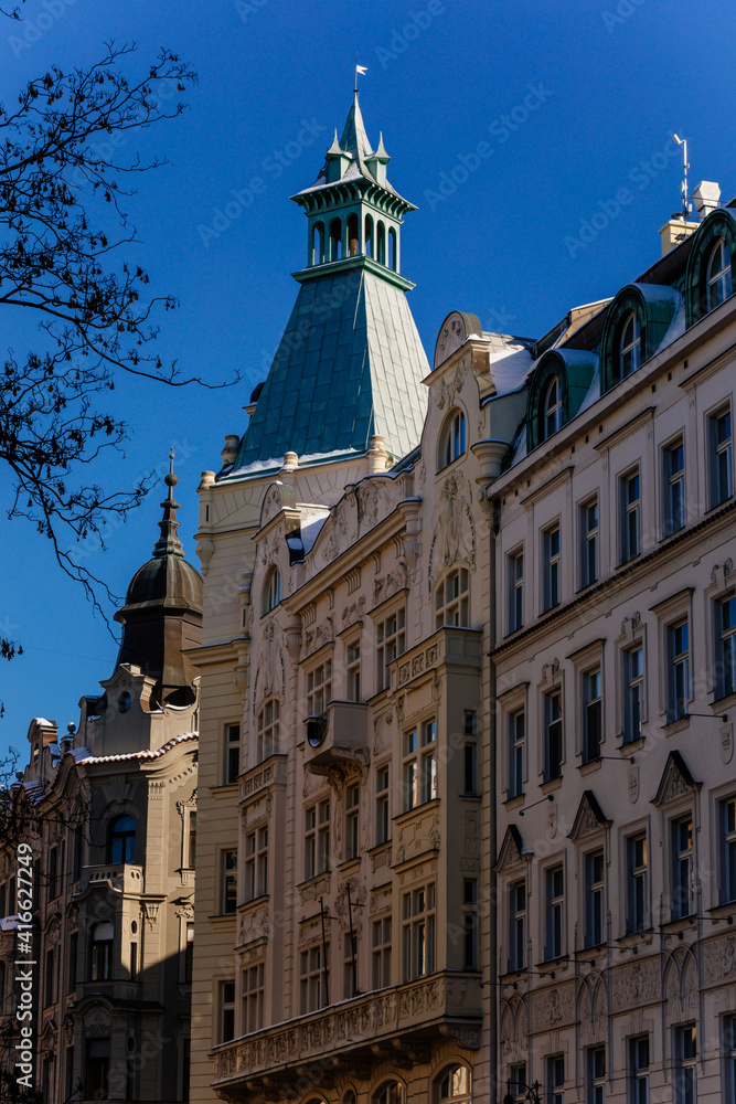Romantic neo-renaissance stately townhouse, Art Nouveau facade, historical building in old town, most prestigious boulevard Parizska Street at sunny day, Prague, Czech Republic