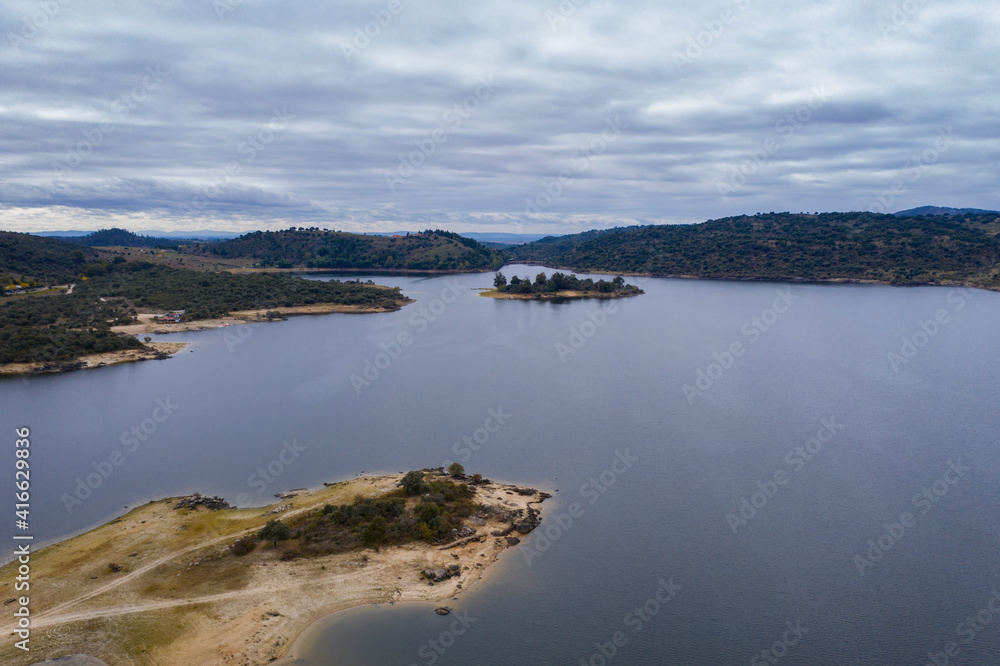 Drone aerial view of Idanha Dam Marechal Carmona landscape with beautiful blue lake water, in Portugal