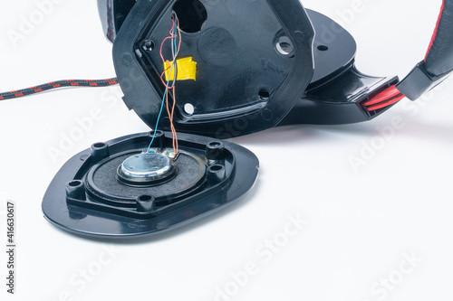 Broken headphones with a microphone. Repair concept. Close-up.