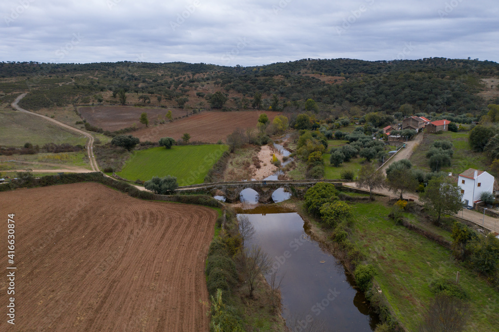 Drone aerial view of an ancient historic stone bridge in Idanha a velha, Portugal