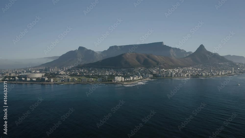 Aerial view of Cape Town, South Africa, with Green Point and Sea Point, Table Mountain, Lion's Head, Signal Hill and Devil's Peak on a bright and sunny day filmed in 4k with a drone Aerial view of Cape Town, South Africa, with Green Point and Sea Point, Table Mountain, Lion's Head, Signal Hill and Devil's Peak on a bright and sunny day filmed in 4k with a drone