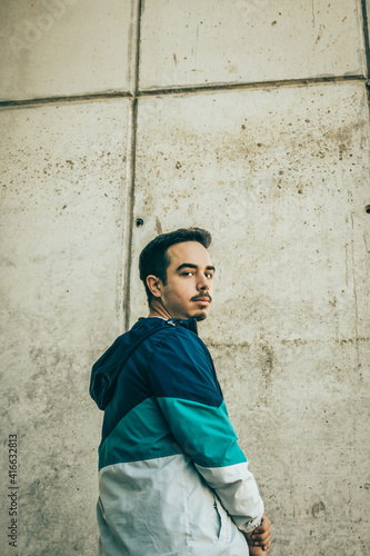 Boy with blue jacket posing