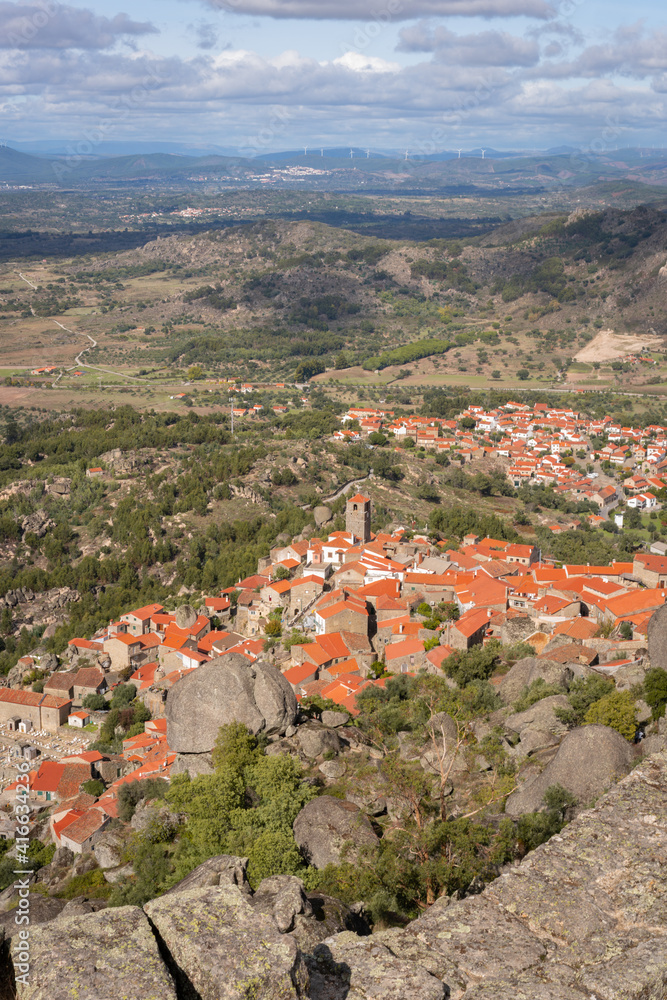 Obraz premium Monsanto historic village with stone boulder buildings and rooftops seen from the castle, in Portugal