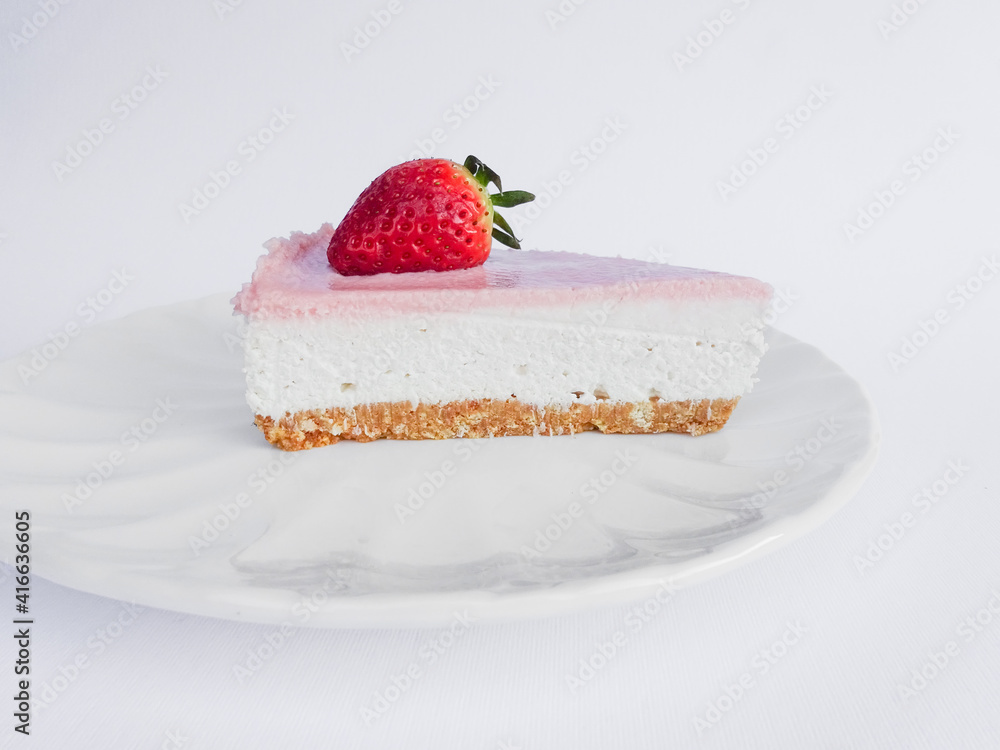 Homemade cheesecake with fresh strawberries for dessert - healthy organic summer pie .Cheesecake isolated on white background Homemade cheesecake with fresh strawberries for dessert - healthy organic summer pie .Cheesecake isolated on white background