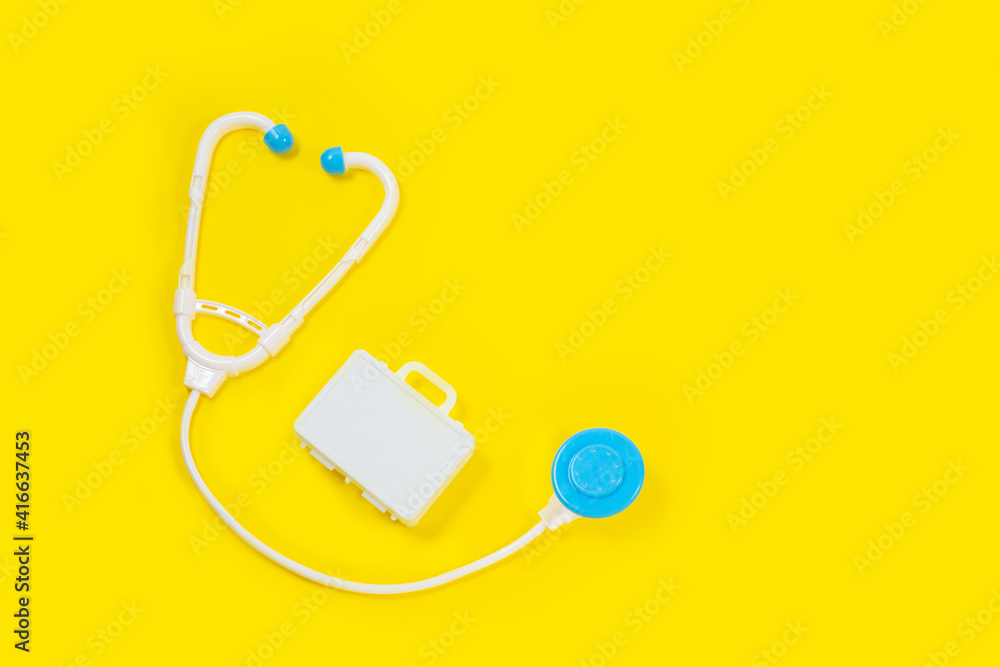 Toy medical devices on a yellow background. Toy medical devices on a yellow background.