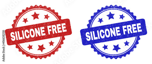 Rosette SILICONE FREE seals. Flat vector scratched seals with SILICONE FREE title inside rosette with stars, in blue and red color versions. Imprints with grunge surface.