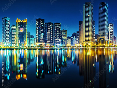 Cityscape reflection on a lake at night 
