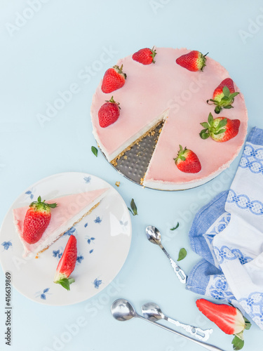Creamy mascarpone cheese cake with strawberry . Piece of New York Cheesecake. Close up. Christmas dessert. Healthy food. Flat lay creative food concept.