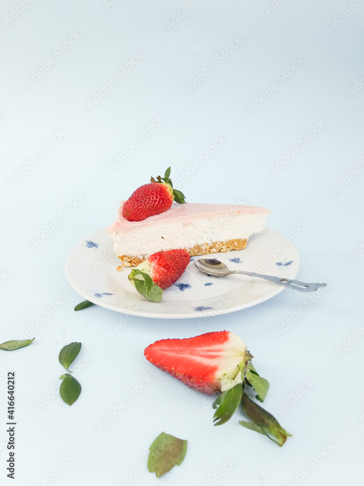 Creamy mascarpone cheese cake with strawberry . Piece of New York Cheesecake. Close up. Christmas dessert. Healthy food. Flat lay creative food concept. Creamy mascarpone cheese cake with strawberry . Piece of New York Cheesecake. Close up. Christmas dessert. Healthy food. Flat lay creative food concept.