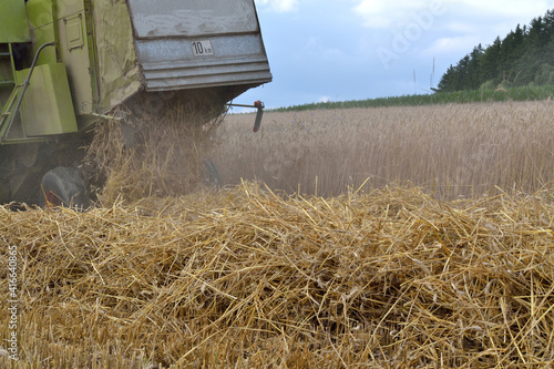 Combine Harvester At Grain Crop