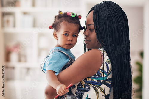 Wallpaper Mural portrait of african american mother and toddler baby girl at home Torontodigital.ca