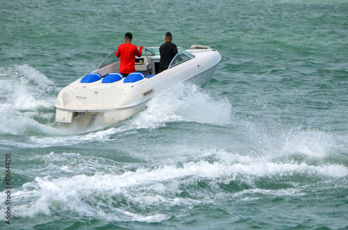 Small high-end sporty run-about motor boat. 