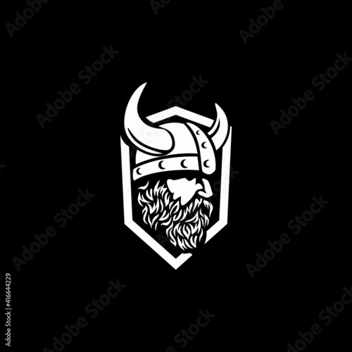 Head of bearded viking warrior with horned viking helmet.

