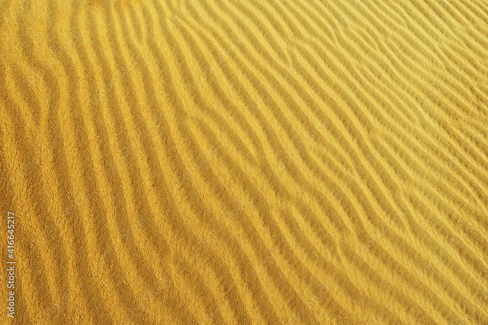 sand texture on a desert dune with patterns in the form of waves created by the wind sand texture on a desert dune with patterns in the form of waves created by the wind