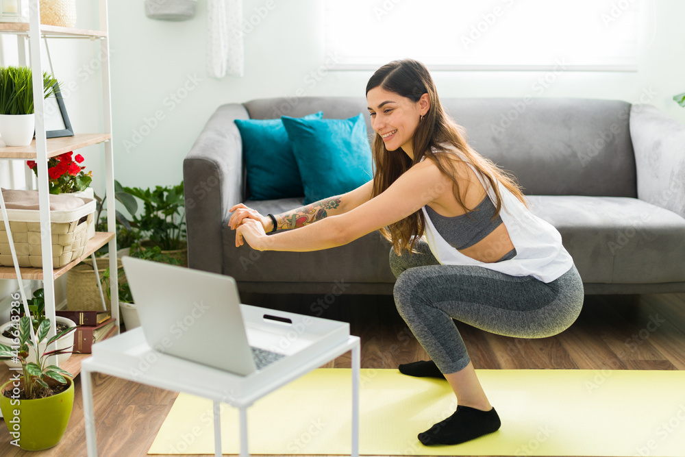 Young woman feeling excited to do a home workout