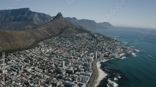 Aerial view of Cape Town, Western Cape, South Africa, with Cape peninsula, Green Point, V and A waterfront, Cape Town Stadium, De Waterkant, on a bright and sunny day filmed in 4k with a drone photo