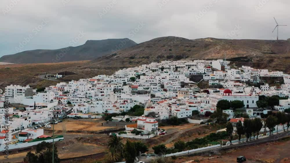 Resorts and hotels amidst brown mountains beside sand dunes of Maspalomas. Aerial. Resorts and hotels amidst brown mountains beside sand dunes of Maspalomas. Aerial.