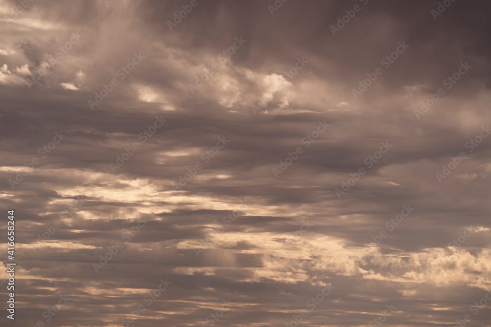 This photograph features a sky filled with rain clouds.