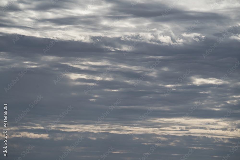 This nature photo captures a scenic cloudscape rolling through the sky.