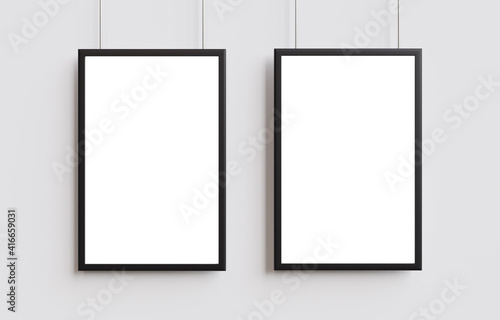 Two white poster with black frame mockup on wall. 3d illustration.