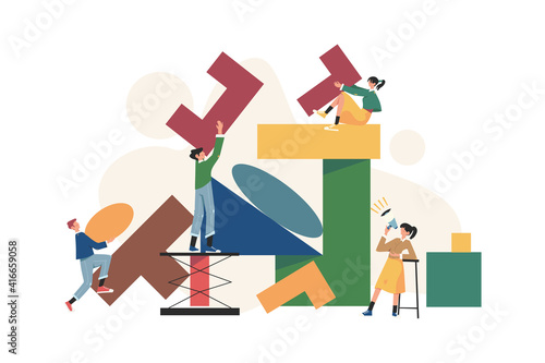 A team of people assemble an abstract geometric puzzle