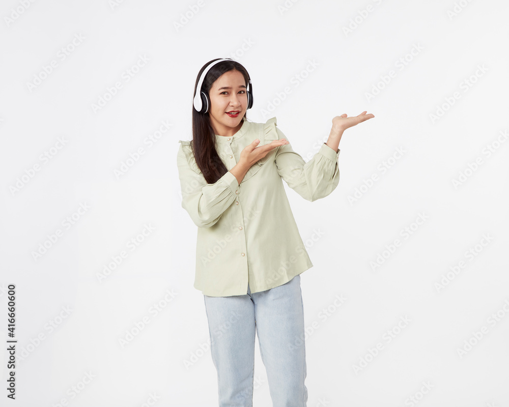 Joyful beautiful young Asian girl in headphones Joyful beautiful young Asian girl in headphones