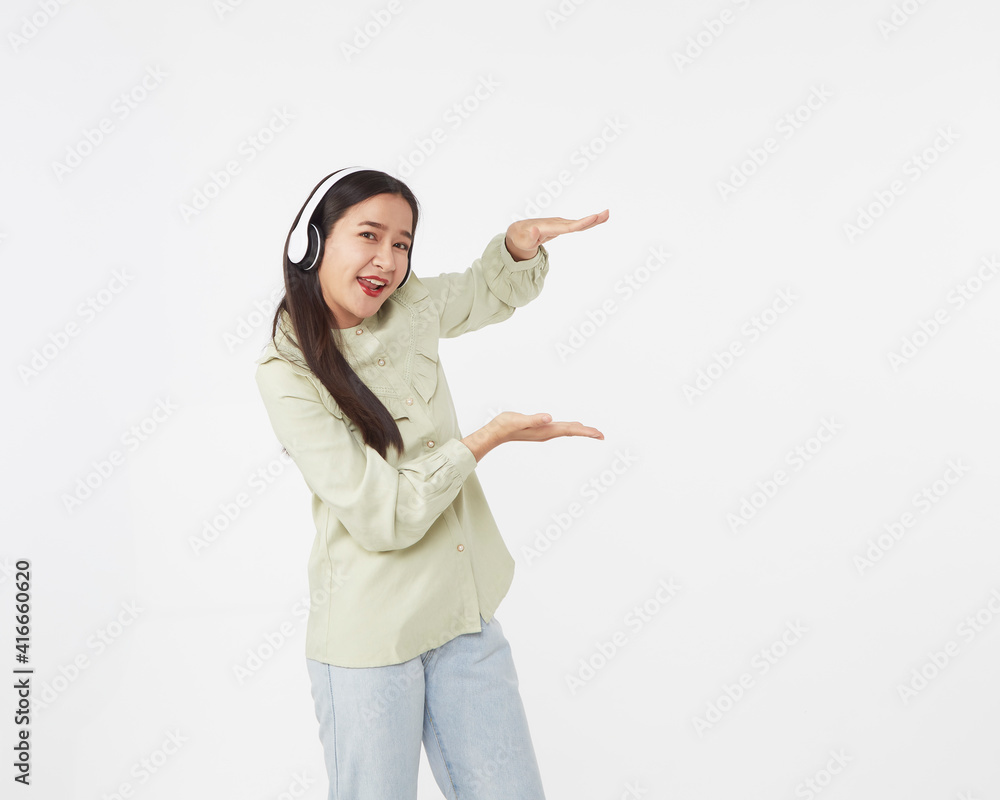 Joyful beautiful young Asian girl in headphones Joyful beautiful young Asian girl in headphones