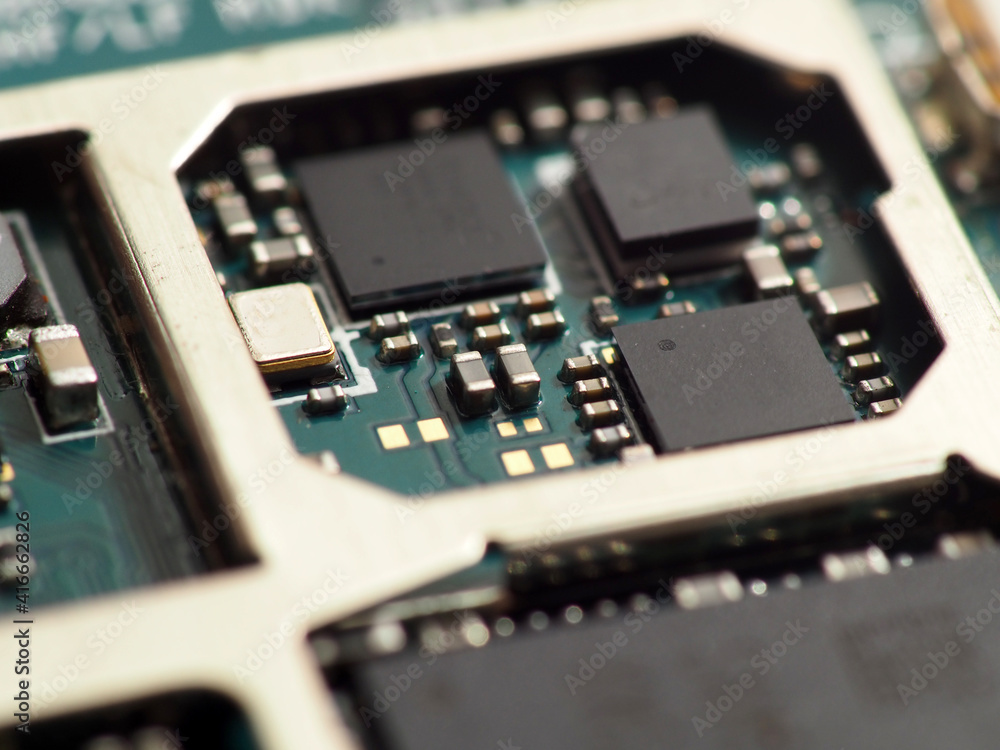 Close up shoot of Surface Mount Device (SMD) parts such as IC, micro chips, processors, led, resistor, capacitor, camera module, etc. soldered on Printed Circuit Board (PCB) Close up shoot of Surface Mount Device (SMD) parts such as IC, micro chips, processors, led, resistor, capacitor, camera module, etc. soldered on Printed Circuit Board (PCB)