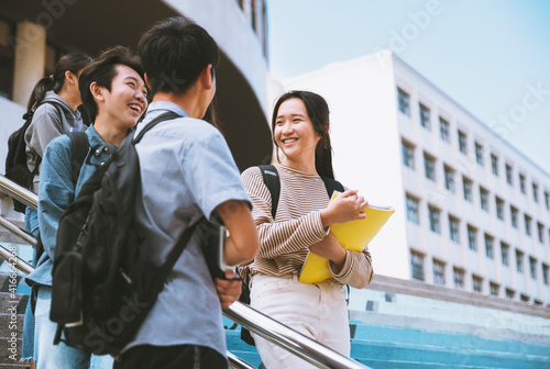 Happy Teenager Students talking and Walking On Stairs