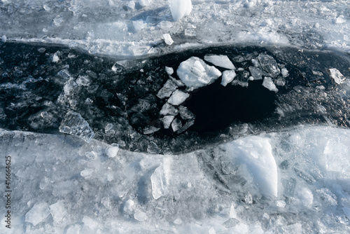 Big crack on the ice on Lake Baikal in winter. Russia Siberia.