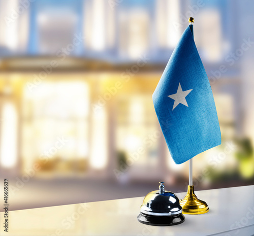 Somalia flag on the reception desk in the lobby of the hotel photo