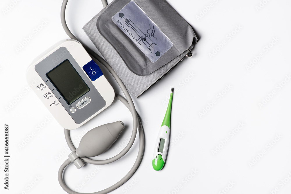 tonometer and thermometer on a white background tonometer and thermometer on a white background