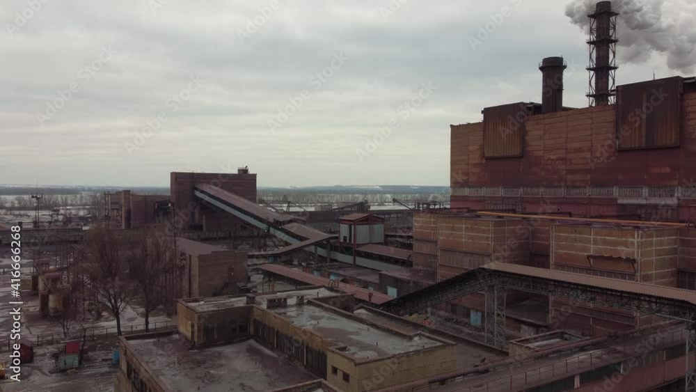 smoking chimney Poltava Mining and Processing Plant. The largest in Ukraine producer and exporter of iron ore pellets used in ferrous metallurgy and steel production. video filmed with a drone smoking chimney Poltava Mining and Processing Plant. The largest in Ukraine producer and exporter of iron ore pellets used in ferrous metallurgy and steel production. video filmed with a drone
