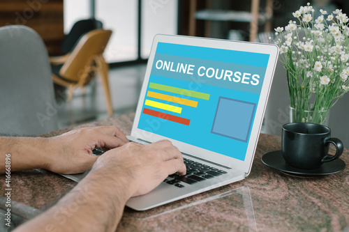 Businessman using laptop find an online course of interest.