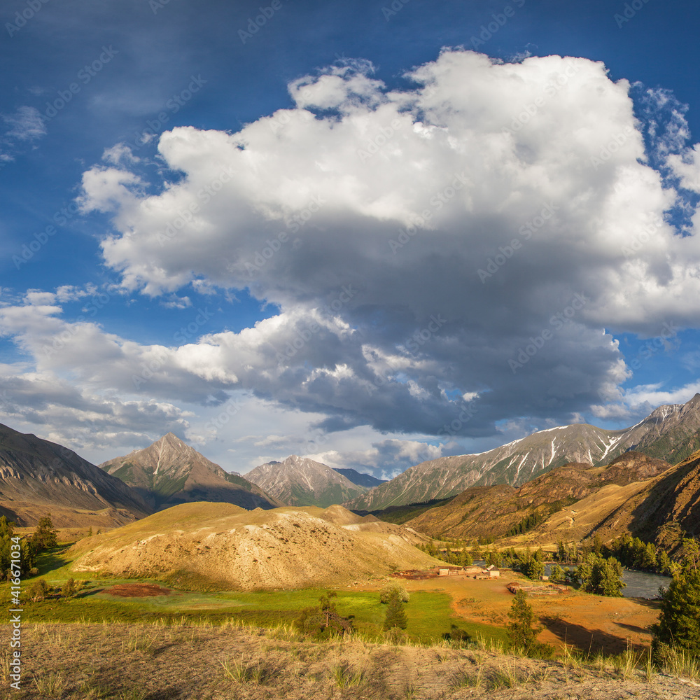 Valley in the Altai mountains on a summer day, picturesque sky with clouds	