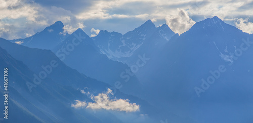 Mountain peaks in blue haze, morning view